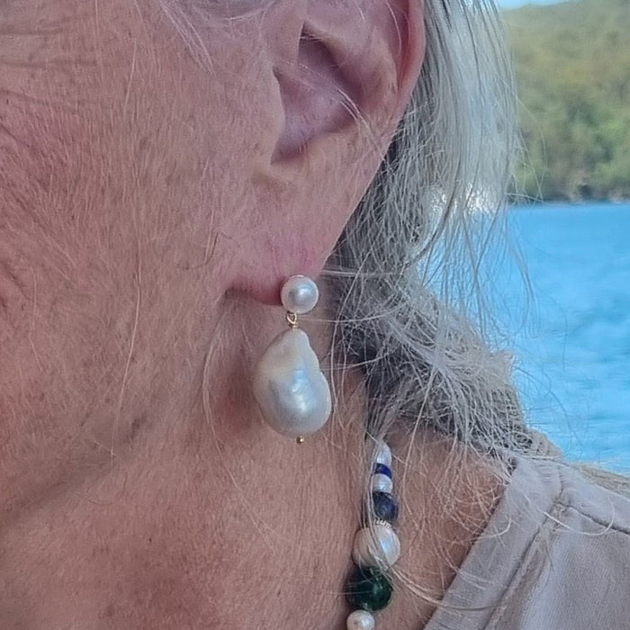 Carly Large Baroque Pearl Earrings on ear