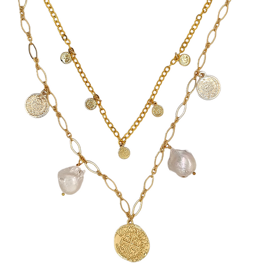 A two-layer gold necklace with integrated white freshwater pearls and gold coin charms, displayed against a white background.