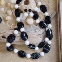 Noir Carved White Coral and Sardonyx banded Agate Necklace