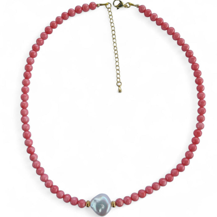 Necklace with pink beads and a central gray pearl on a white background