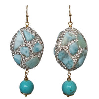 A pair of drop earrings featuring round dyed turquoise stones and 18k gold plated brass with crystal embellishments.