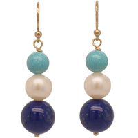A pair of earrings featuring a tiered design with blue Lapis Lazuli, turquoise, and white freshwater pearl, all hanging from gold-colored hooks.