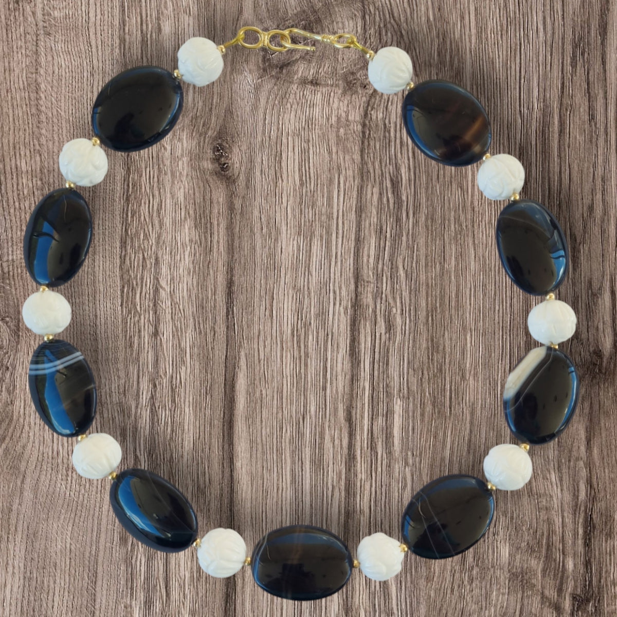 Noir Carved White Coral and Sardonyx banded Agate Necklace