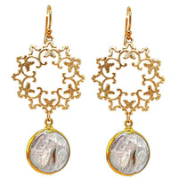 A pair of gold-wrapped fresh water pearl earrings with intricate gold wreath designs.