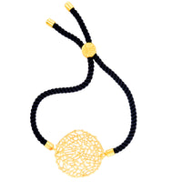 An adjustable bracelet with a gold-plated circular charm and black cord.