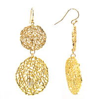 A pair of gold wire mesh circle earrings dangle elegantly against a white background.