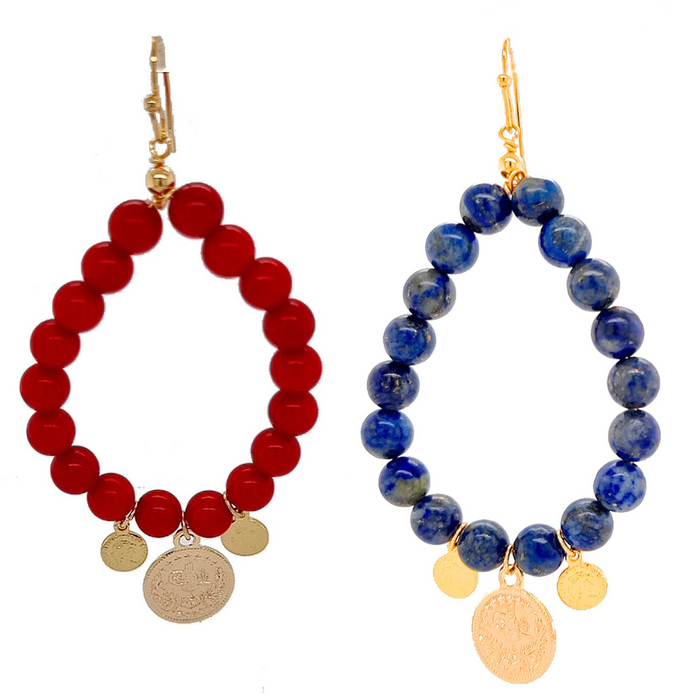 A pair of elegant earrings featuring round red sea bamboo coral and round lapis lazuli stones, with gold-plated brass hooks.